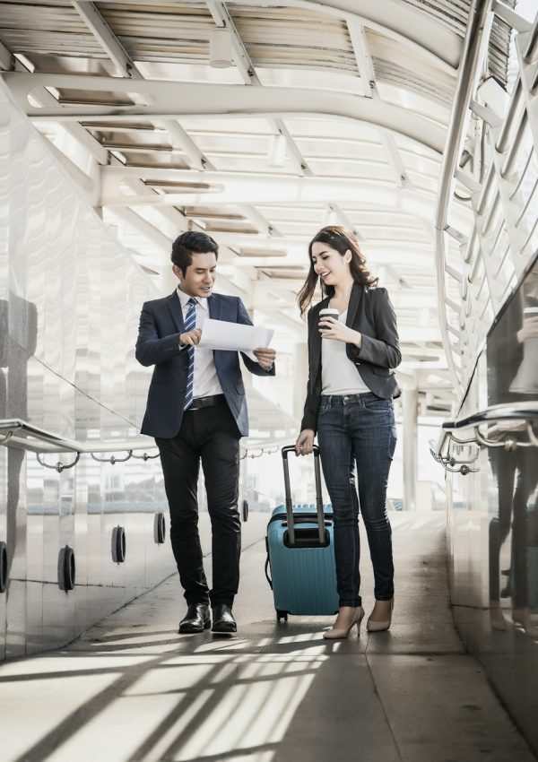 Portrait of two business people meeting before go to traveling. Business travel concept